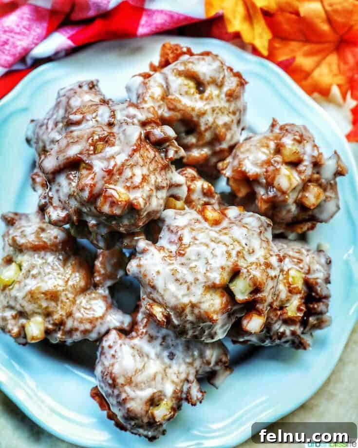 Stacked apple fritters with caramel apple dipping sauce.