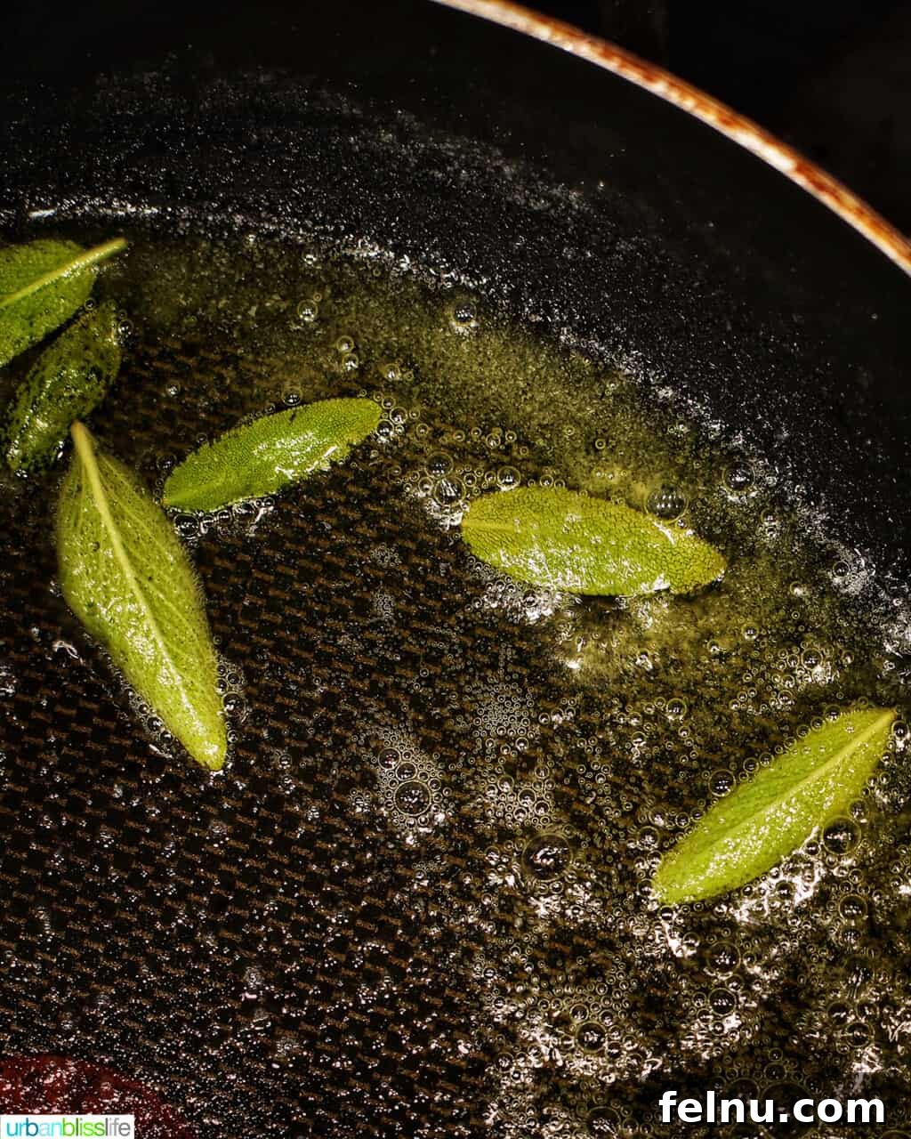 Fresh sage leaves crisping beautifully in a pan of browning butter.
