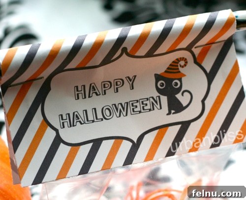 Halloween2012_favorBagLabels01 Close-up of vibrant Halloween Favor Bag Labels, featuring charming ghost, pumpkin, and bat designs, ready to be cut and used