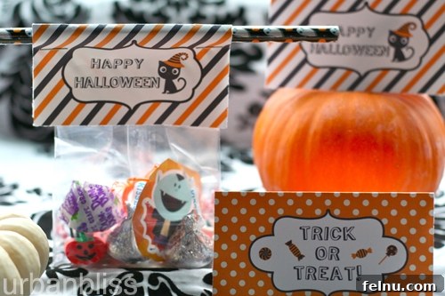 Halloween2012_favorbaglabels06 Halloween Favor Bags elegantly adorned with free printable labels, showcasing a variety of spooky treats inside