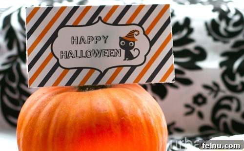 Halloween2012_favorbaglabels03 Halloween Favor Bag Labels displayed alongside coordinating large candy bar wrappers, showcasing a complete festive theme