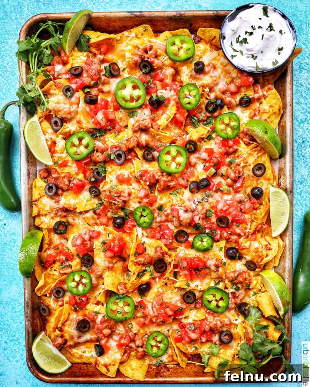 One-Pan Veggie Tex-Mex Nacho Fiesta 2 Sheet Pan Tex Mex Vegetarian Nachos with jalapenos, a colorful and vibrant dish perfect for sharing