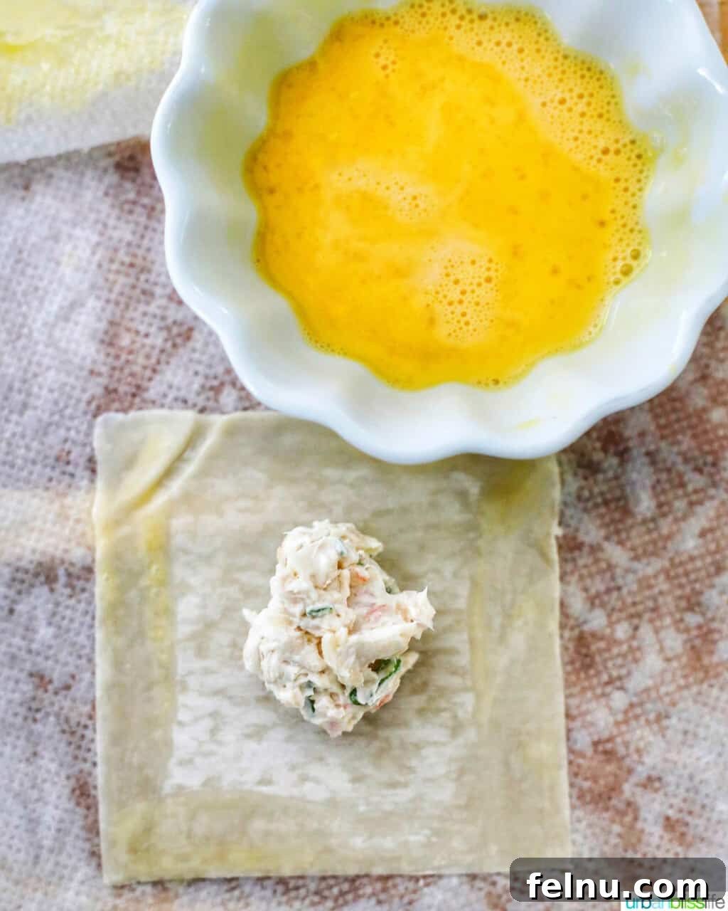 Perfectly Crispy Air Fryer Crab Rangoon 11 Cream cheese filling on wonton with egg wash applied to edges
