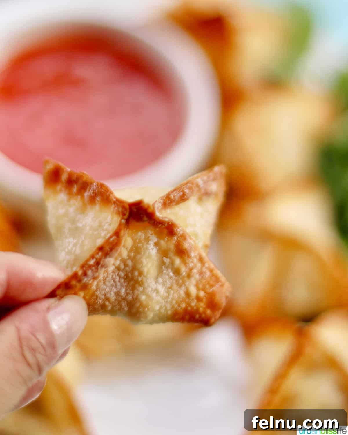 Perfectly Crispy Air Fryer Crab Rangoon 3 Single cooked air fryer crab rangoon, golden and crispy