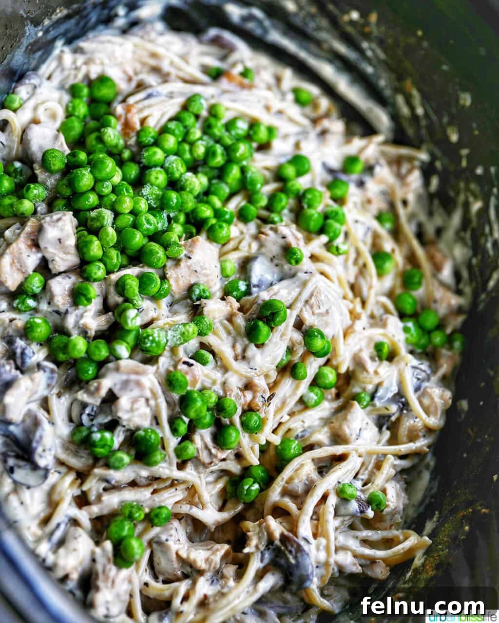 Slow-Cooker Turkey Tetrazzini Delight 17 Adding peas to the crockpot