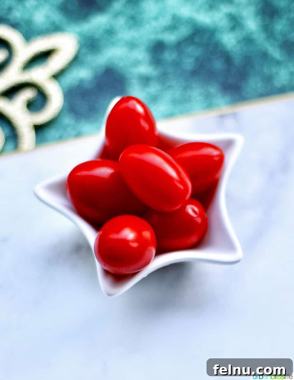 Christmas Tree Vegetable Platter 4 Tomatoes in a star-shaped bowl, ready to top the veggie tray
