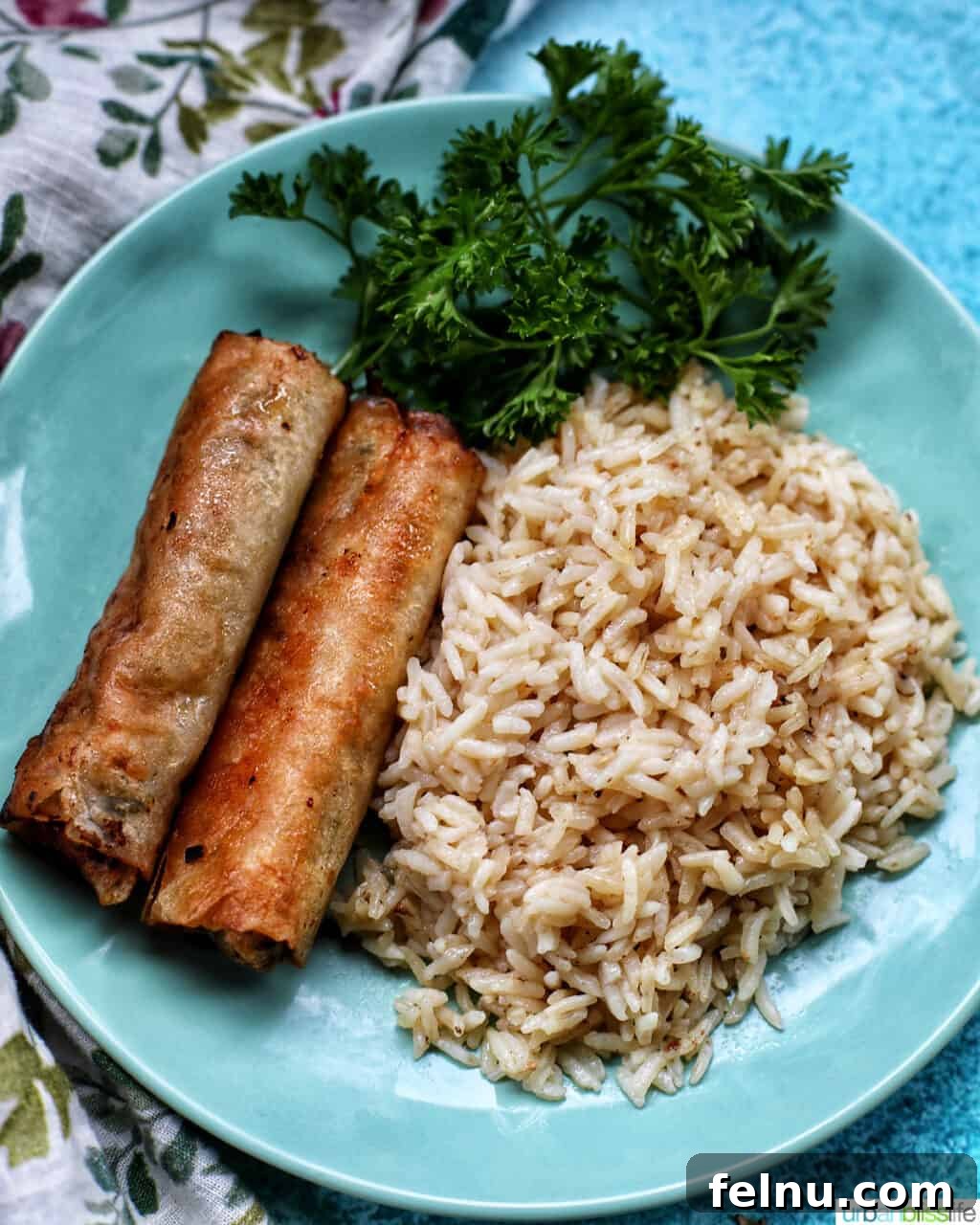 Flavorful Instant Pot Garlic Rice 13 lumpia and garlic rice on a plate