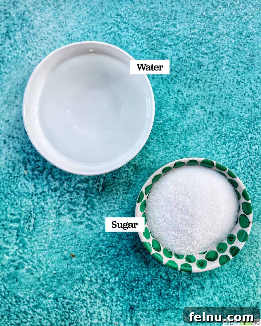 Effortless Simple Syrup: Sweeten Anything 5 A clear glass jar of simple syrup ingredients: water and granulated sugar, neatly laid out on a kitchen counter.