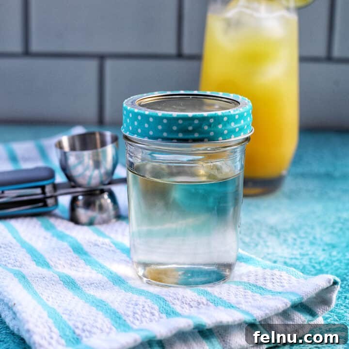 Homemade simple syrup in a mason jar, ready for use.