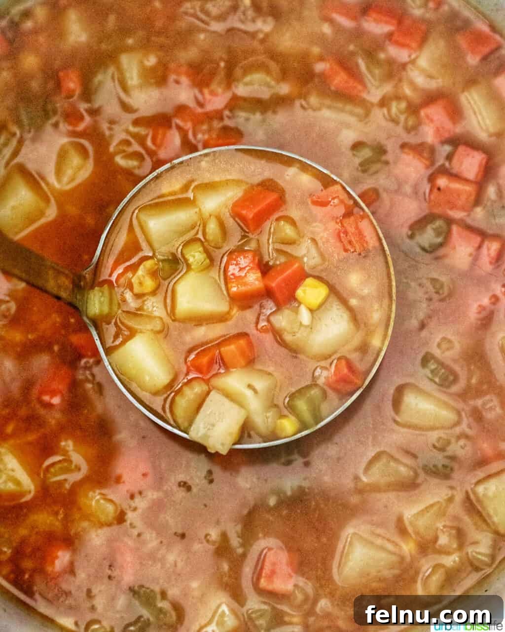 Creamy Potato Corn Chowder Made Easy 16 Ladle of cooked Instant Pot Potato Corn Chowder
