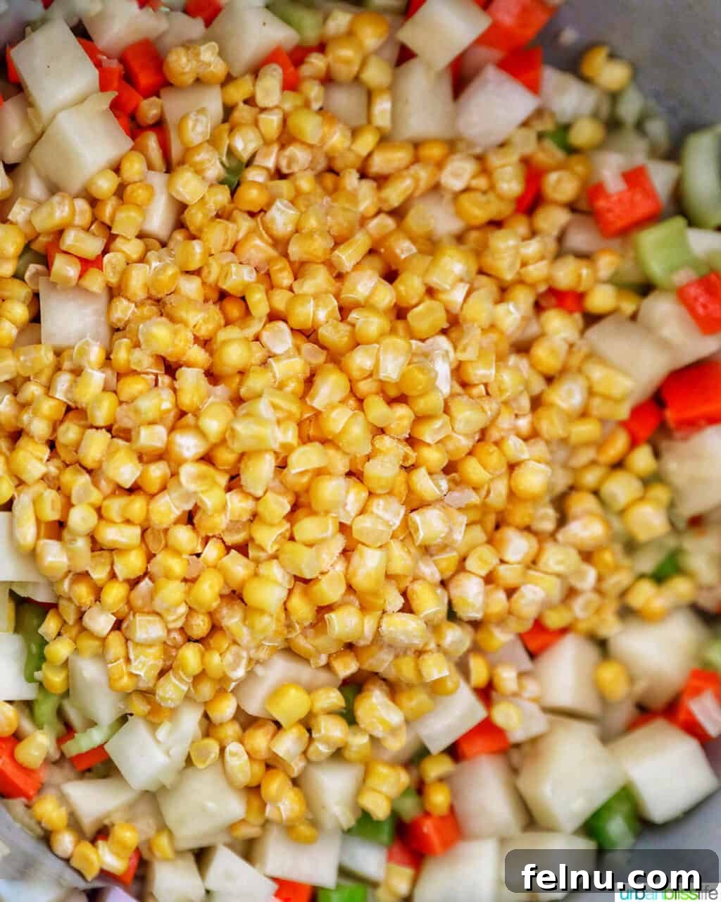 Creamy Potato Corn Chowder Made Easy 10 Corn added to vegetables in the Instant Pot
