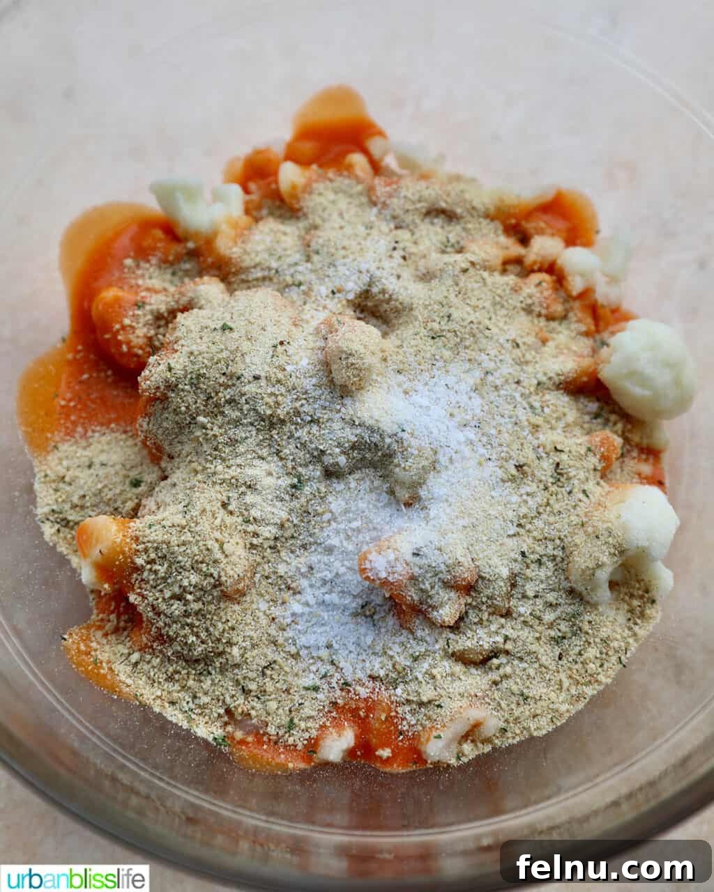 Fiery Air-Fried Cauliflower Poppers 9 Close-up of seasoned cauliflower florets with buffalo sauce and salt.