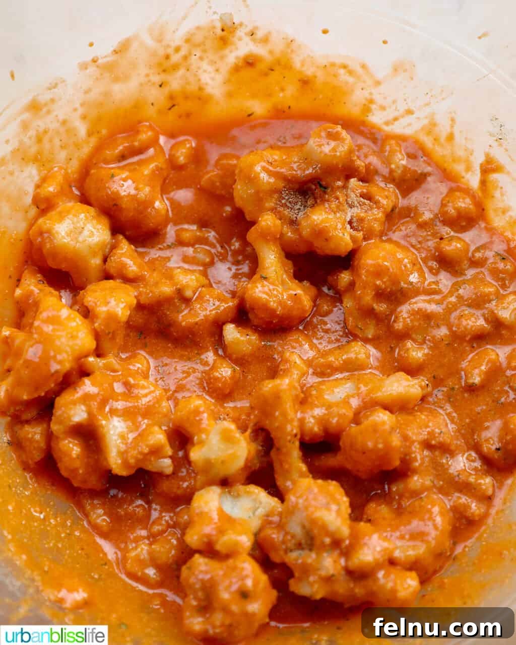 Fiery Air-Fried Cauliflower Poppers 10 Well-coated buffalo cauliflower florets ready for air frying.