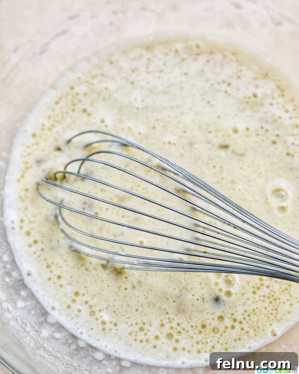 Banana Chocolate Chip Dream Waffles 12 Whisking wet ingredients and dry ingredients together