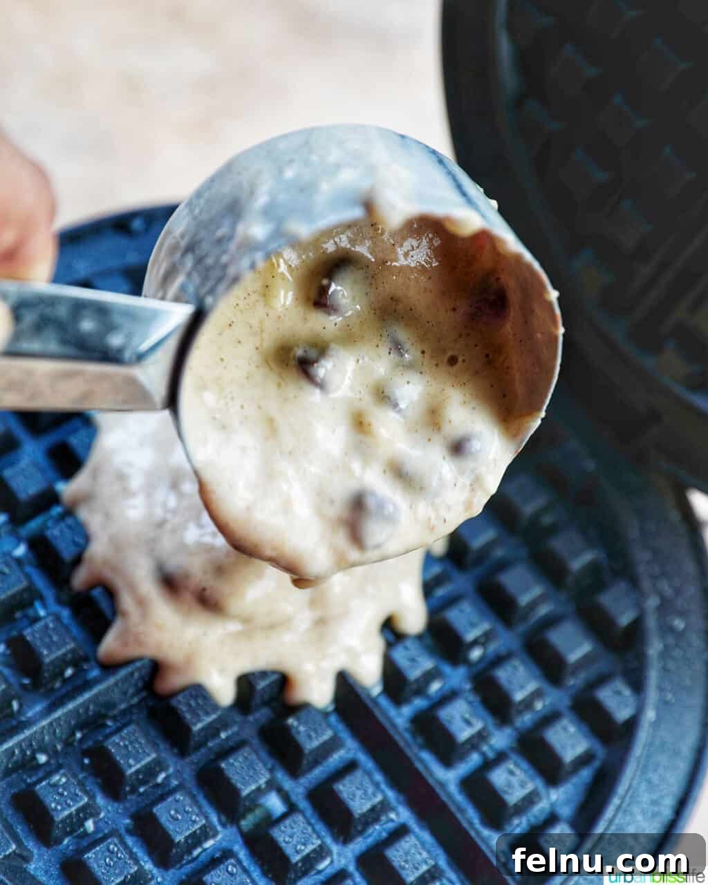 Banana Chocolate Chip Dream Waffles 13 Pouring waffle batter into a waffle maker