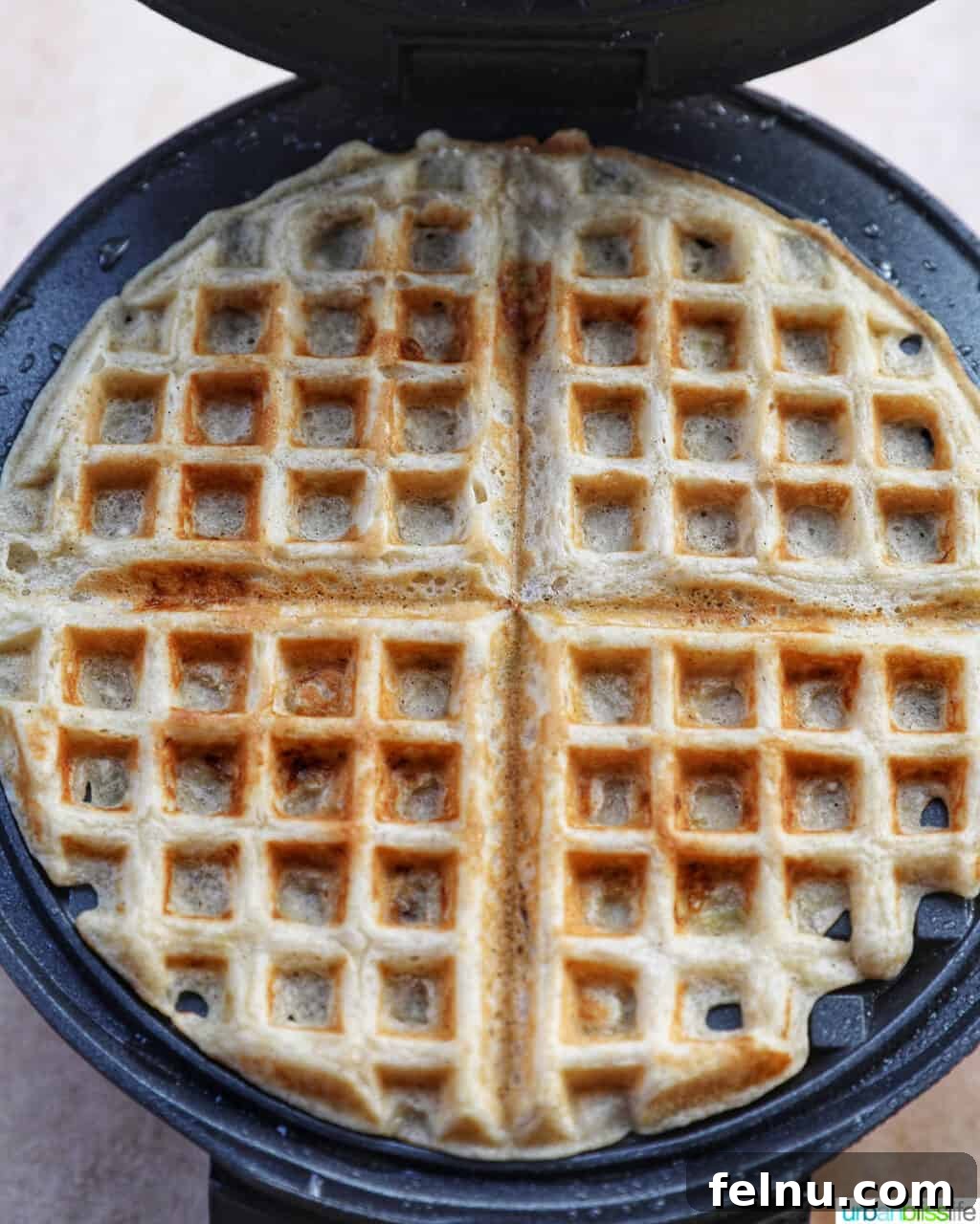 Banana Chocolate Chip Dream Waffles 15 Waffles cooking in a waffle maker