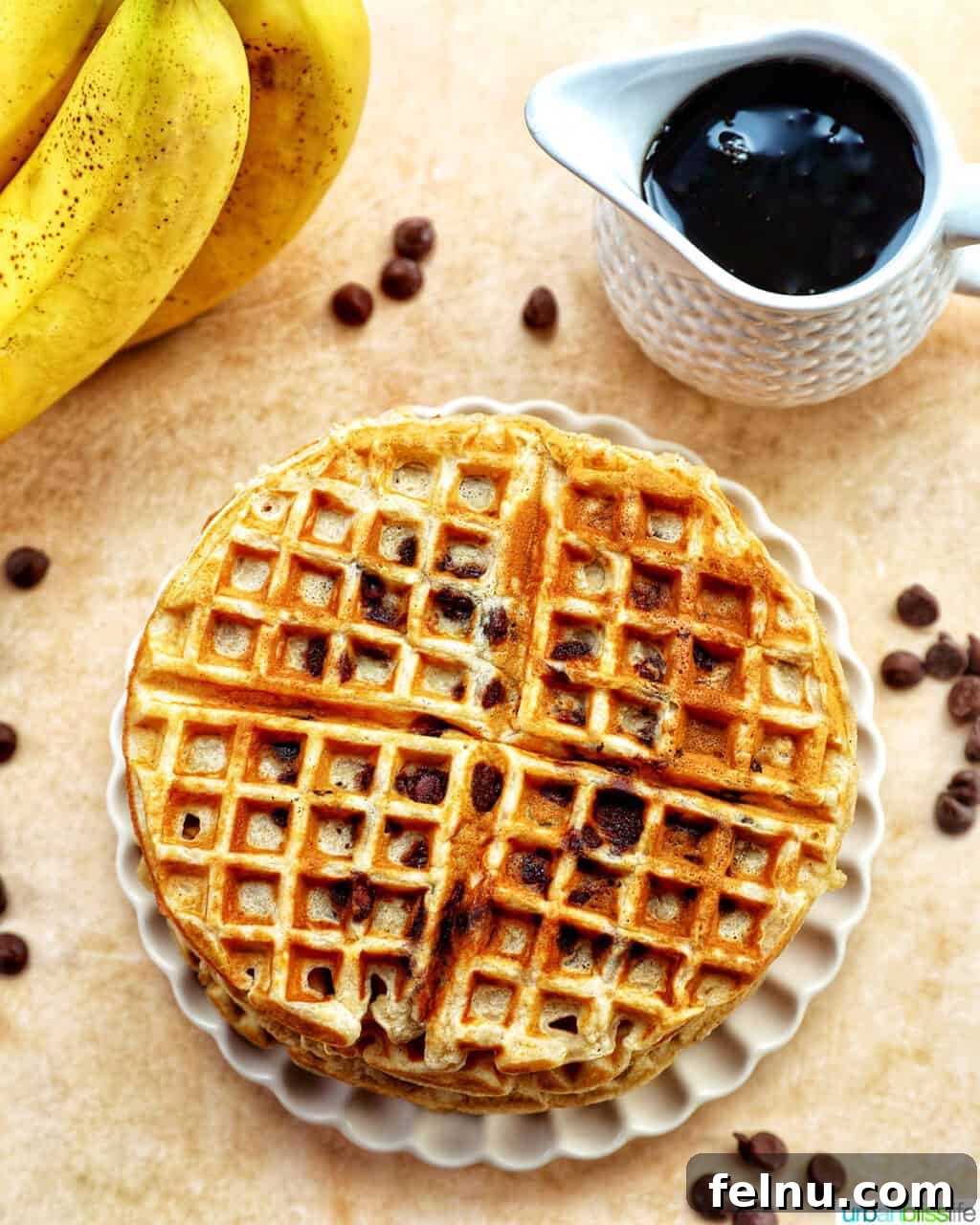 Banana Chocolate Chip Dream Waffles 16 Banana Chocolate Chip Waffles with sliced bananas and syrup