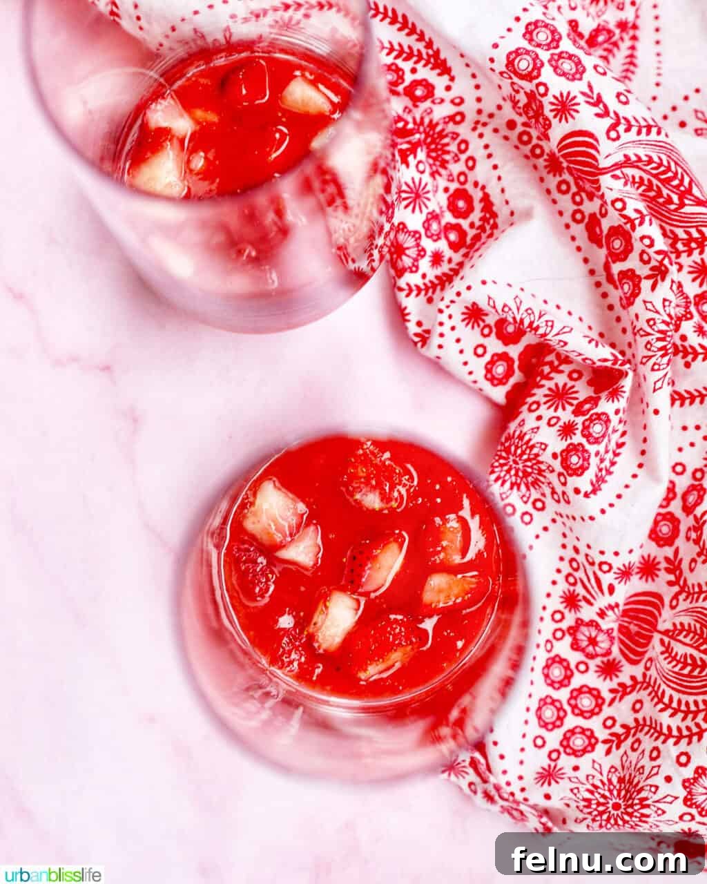 Strawberries added to puree in glasses