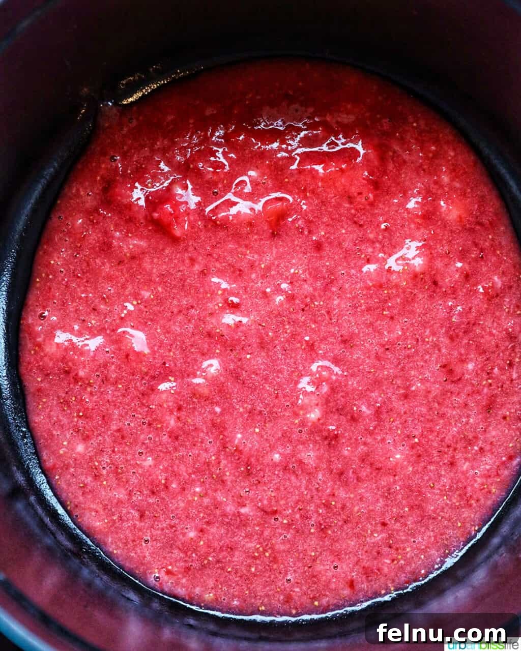Strawberries cooking in a pot
