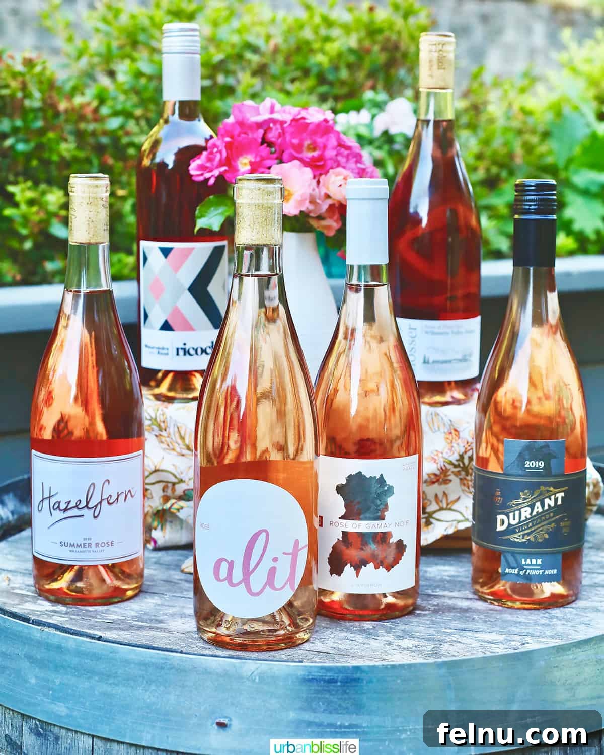 Kickin' Chicken Poppers 18 Seven bottles of best rosé wines from 2021 displayed on a wine barrel.