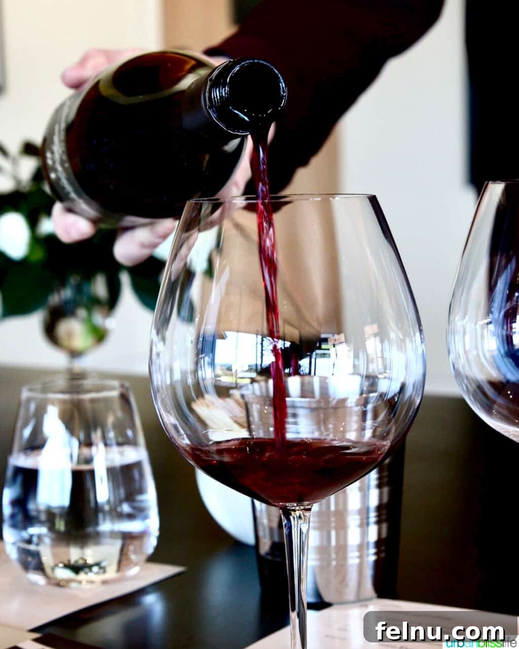 Pouring red wine.