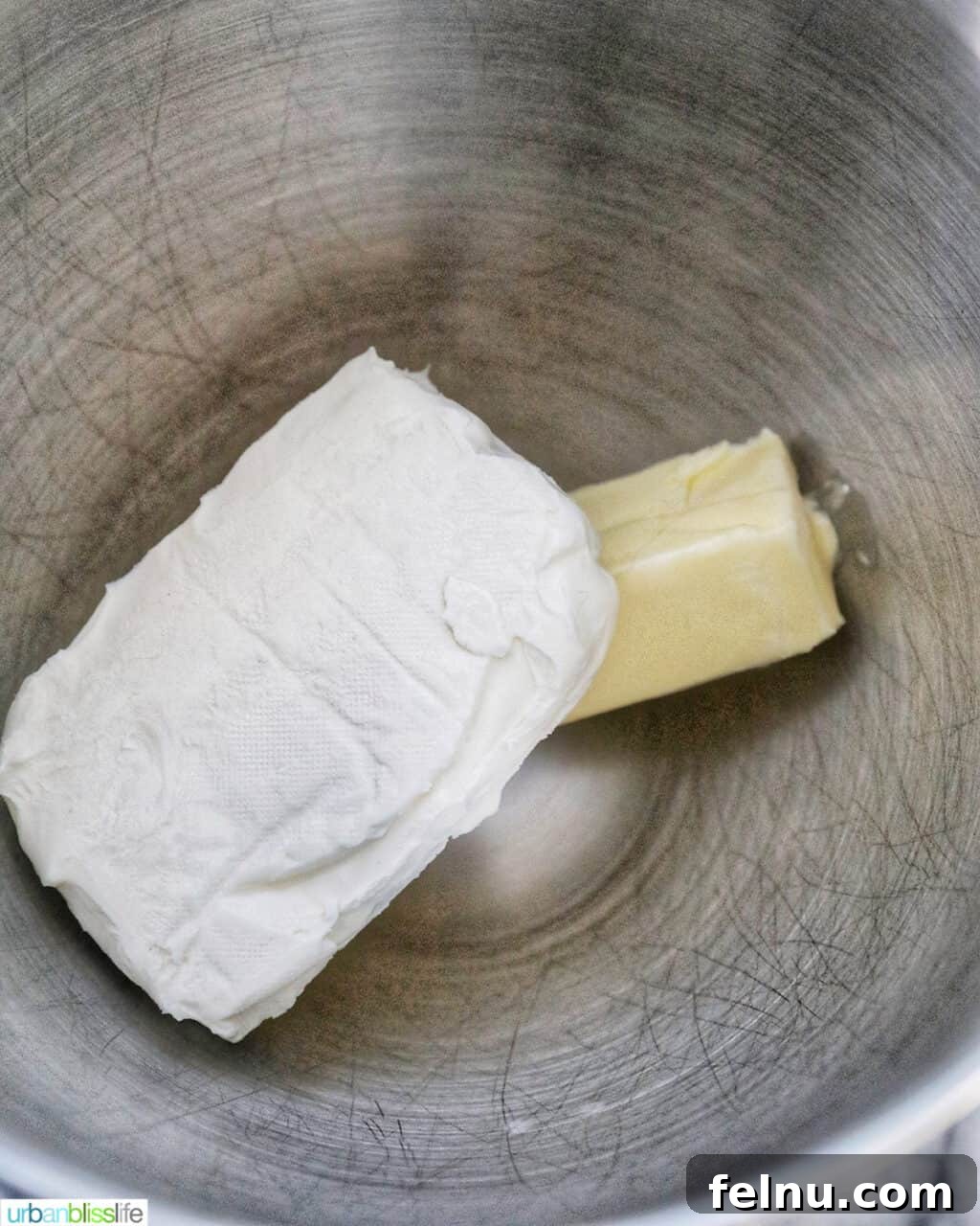 Ultimate Cream Cheese Frosting 5 Softened cream cheese and butter in a stand mixer bowl, ready to be creamed for frosting