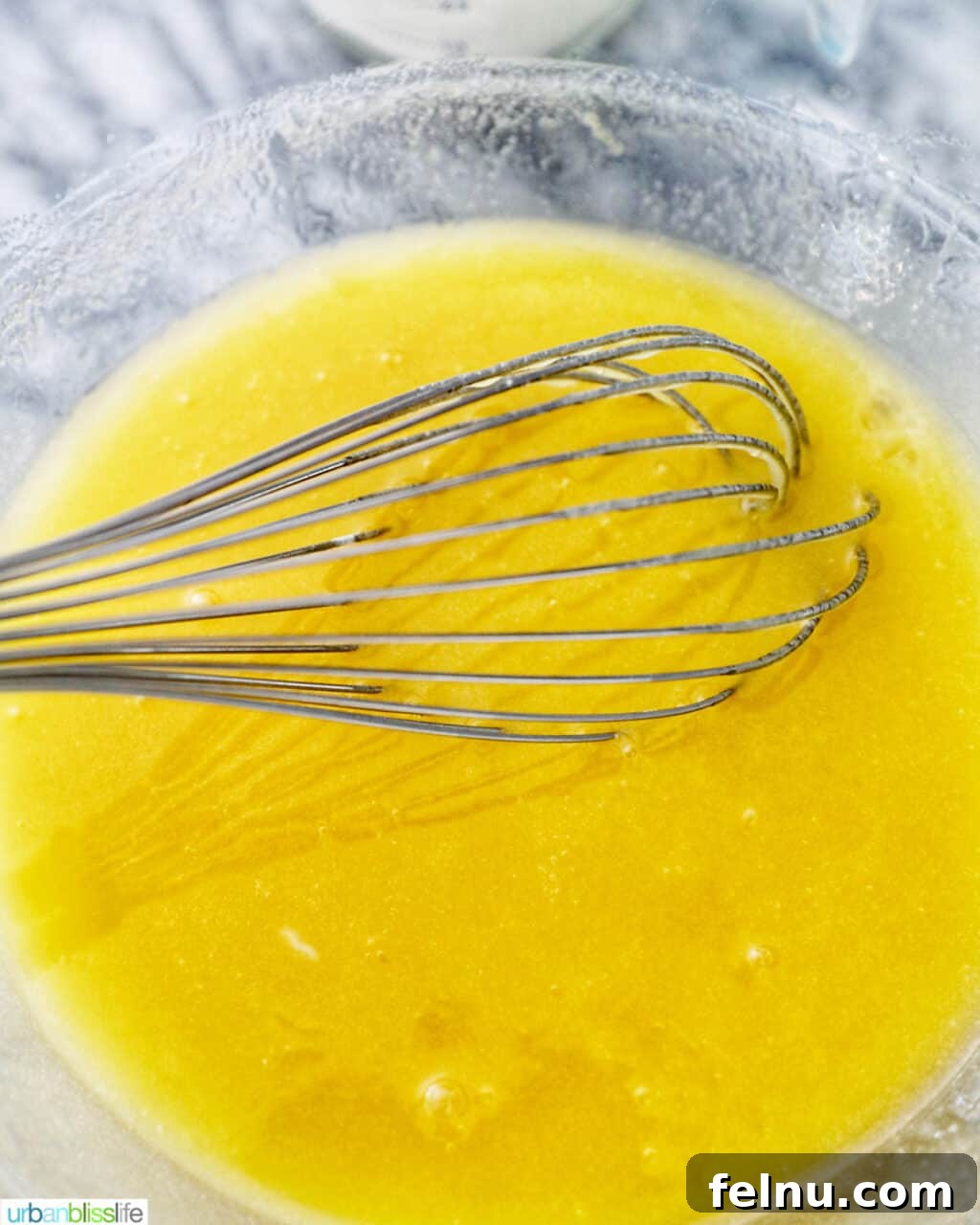 Emerald Velvet Delight with Tangy Cream Cheese 12 Wet ingredients mixture being whisked smoothly.
