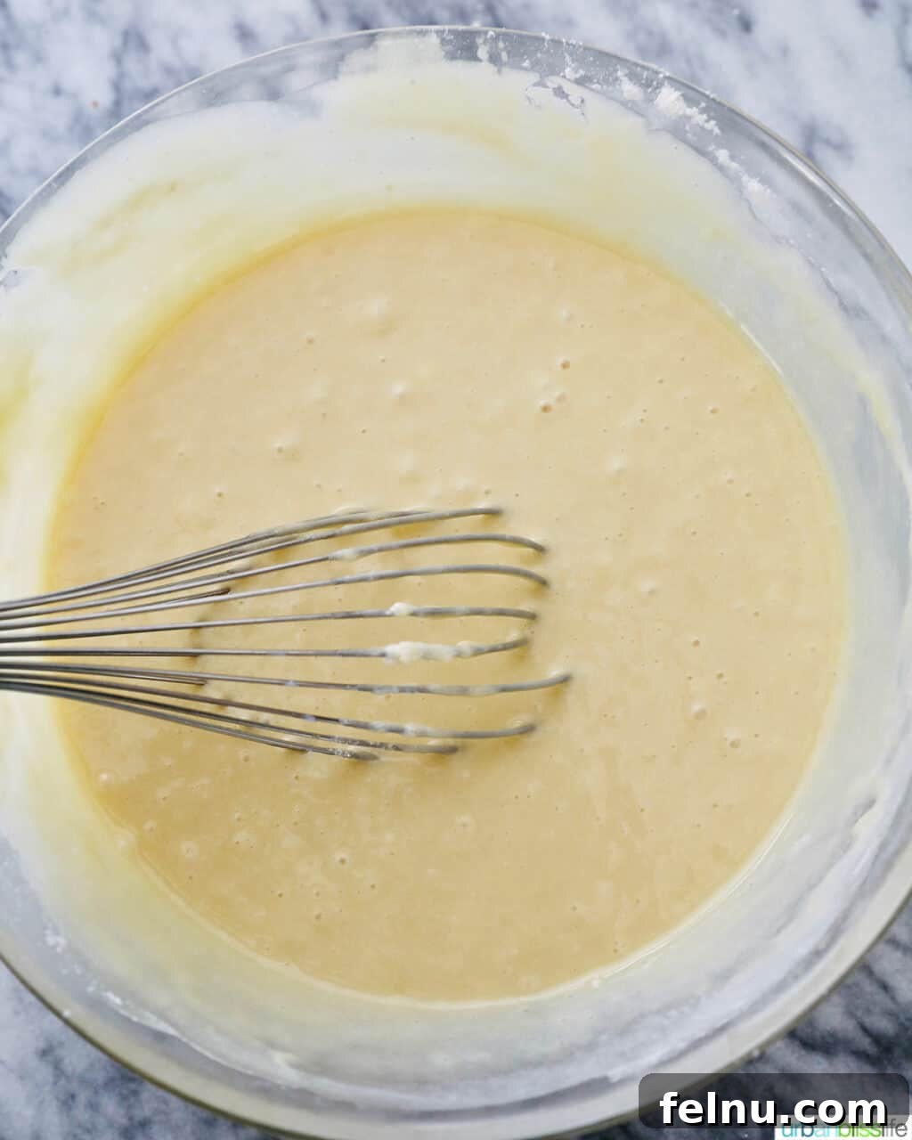 Emerald Velvet Delight with Tangy Cream Cheese 14 Combined wet and dry ingredients being whisked until smooth.