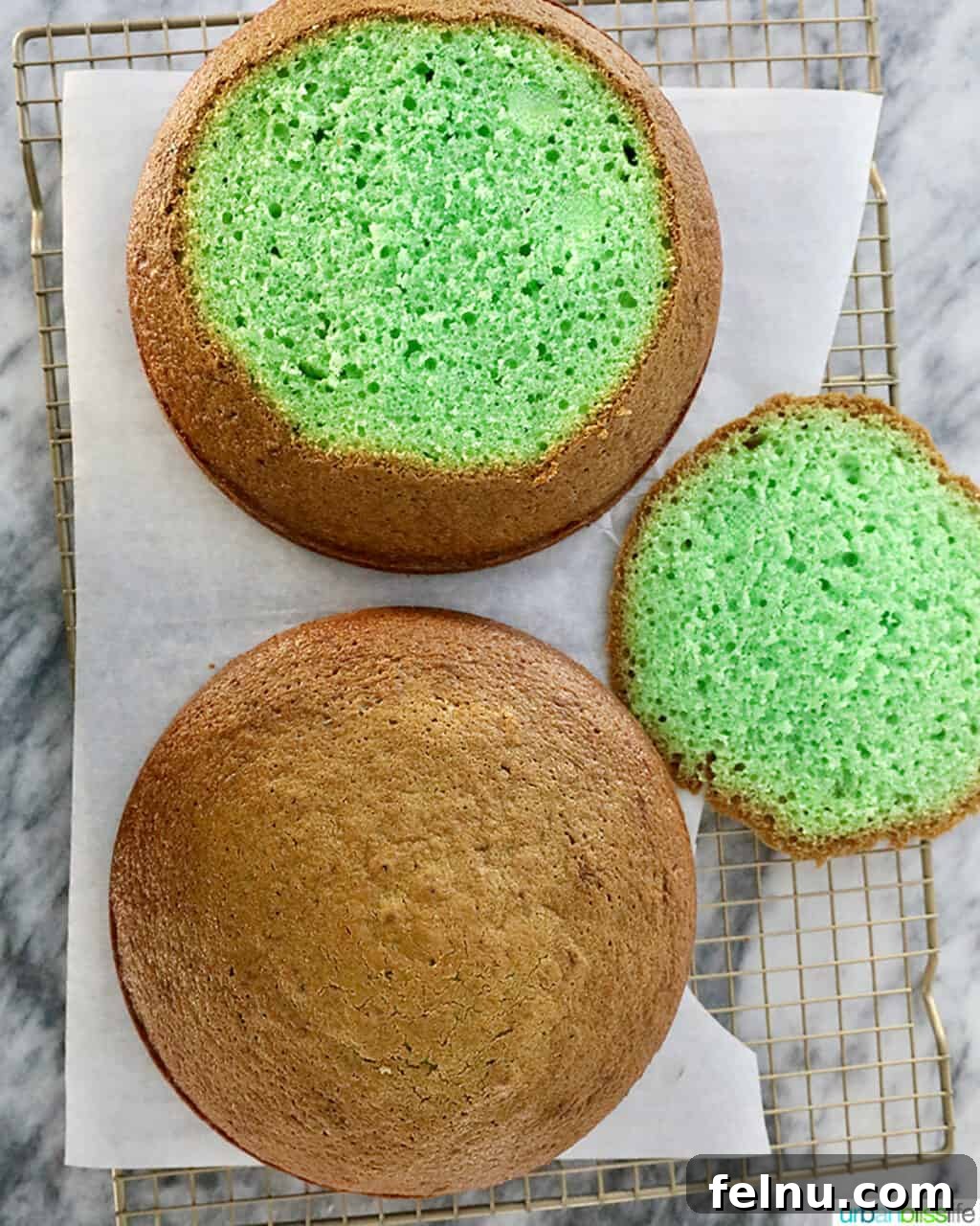 Emerald Velvet Delight with Tangy Cream Cheese 24 A baked green velvet cake layer with its edge trimmed to show only the green interior.