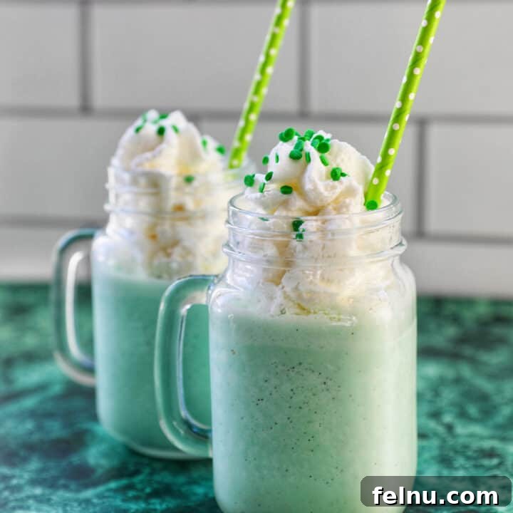 The Best Homemade Shamrock Shake 11 Green Shamrock Shake with whipped cream and green straws.