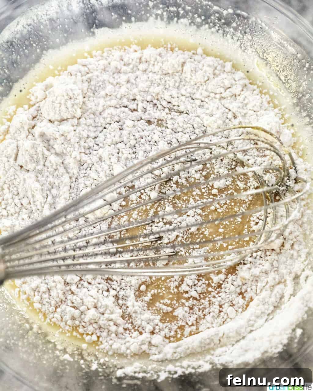 Taisan: Fluffy Filipino Chiffon Cake Perfection 12 Whisking dry ingredients into wet ingredients for Taisan cake batter