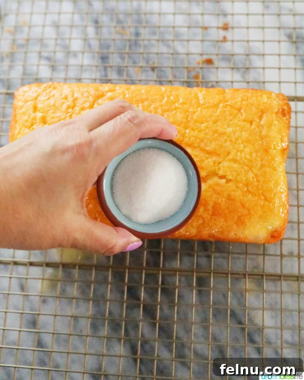 Taisan: Fluffy Filipino Chiffon Cake Perfection 21 Sprinkling granulated sugar onto the buttered top of Taisan cake