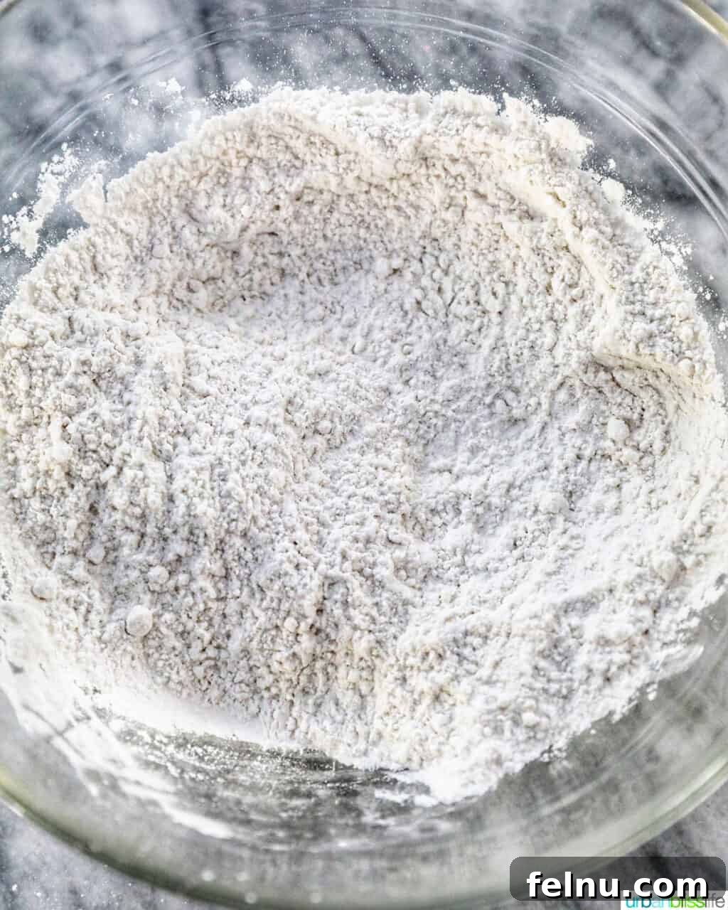Taisan: Fluffy Filipino Chiffon Cake Perfection 7 Dry ingredients for Taisan cake, including flour, in a mixing bowl
