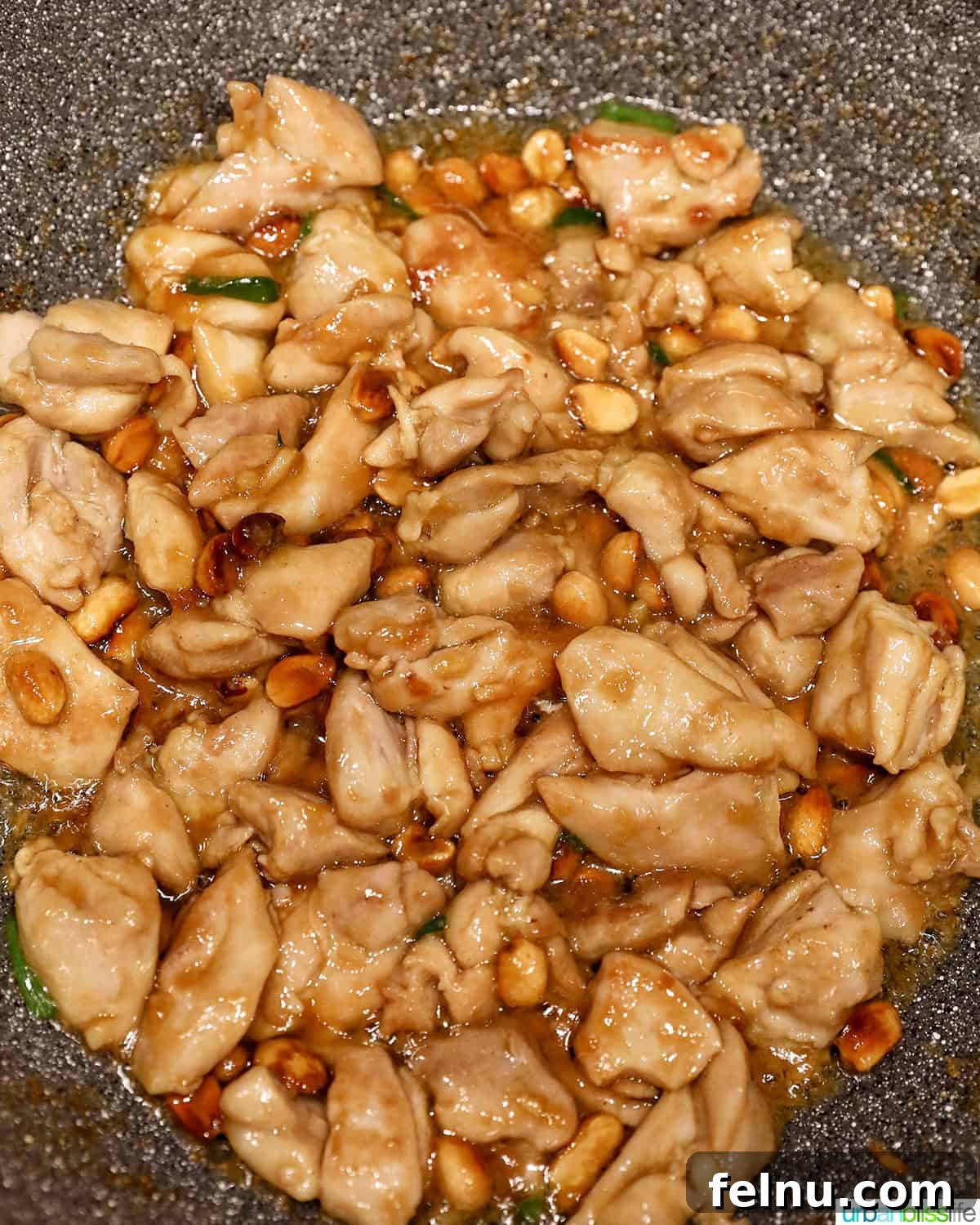Weeknight Kung Pao Chicken 15 Cooking marinated chicken in a wok