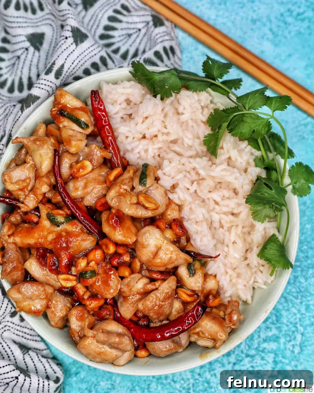 Weeknight Kung Pao Chicken 20 Kung Pao Chicken served with white rice and chopsticks