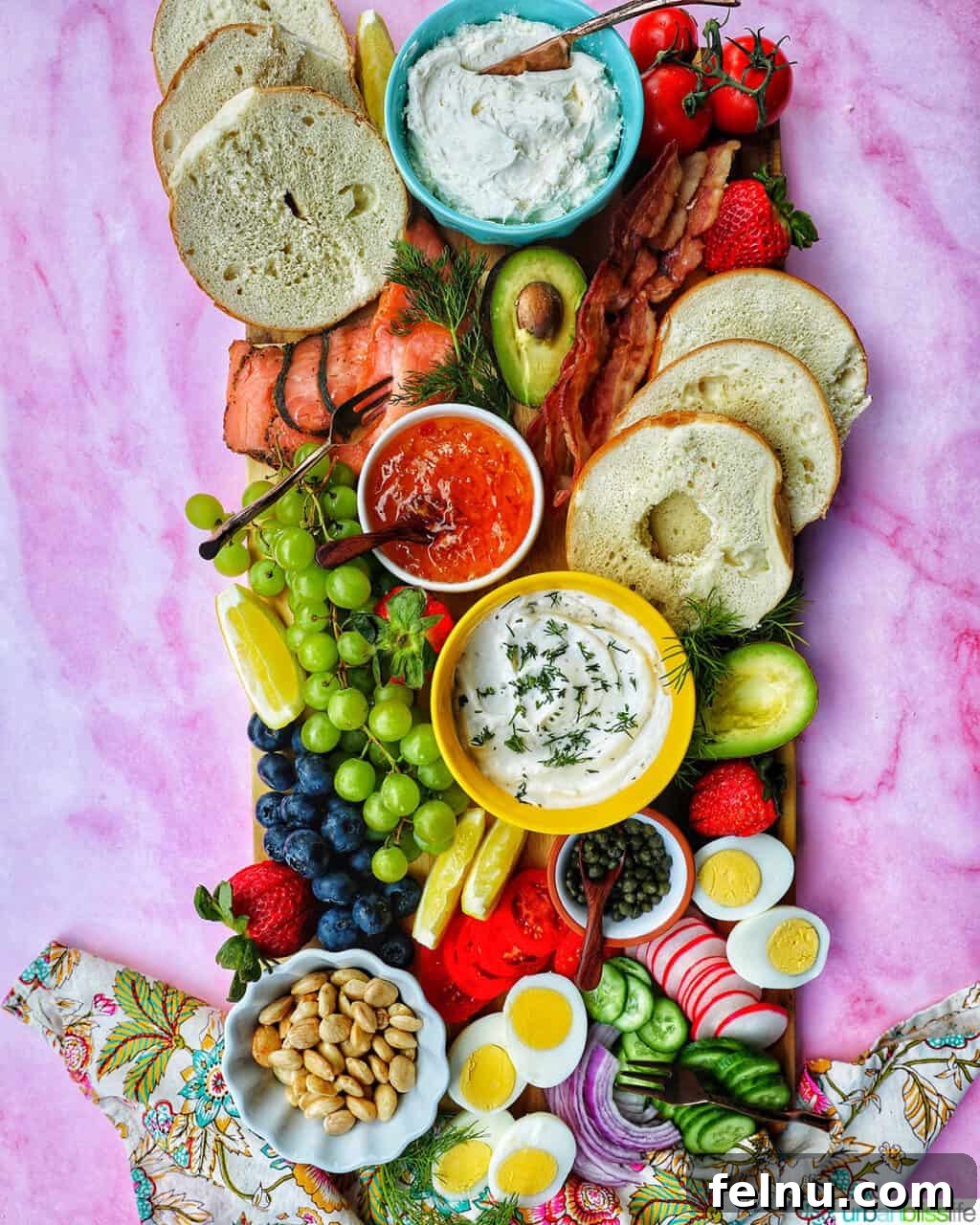 Brunch Grazing Platter 17 A beautifully assembled brunch charcuterie board showcasing a harmonious blend of fruits, vegetables, bagels, and dips, perfect for a memorable gathering.