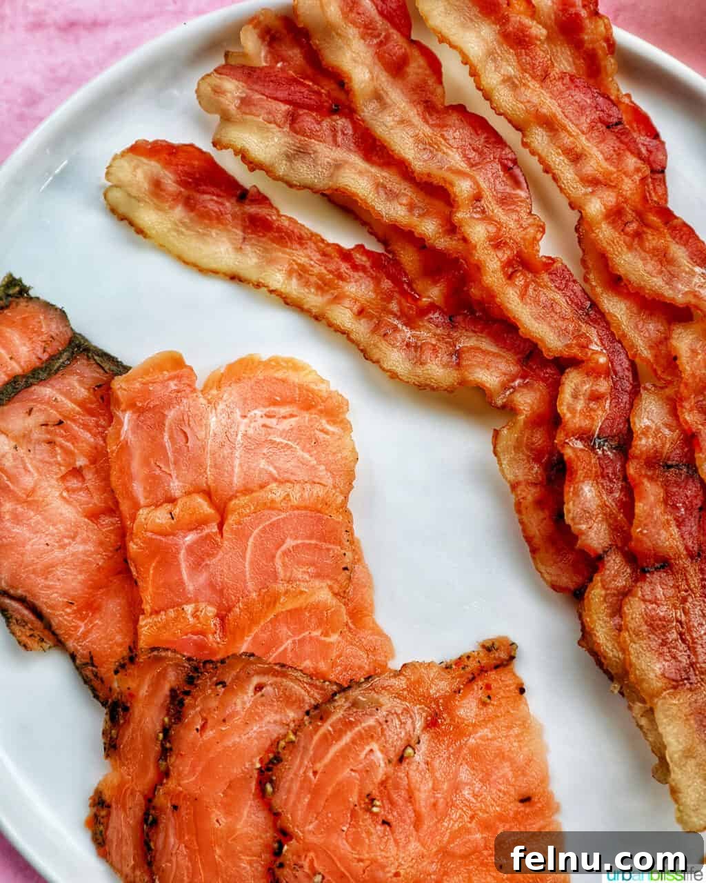 Brunch Grazing Platter 6 A plate showcasing smoked salmon and crispy bacon, essential components of a brunch charcuterie board.