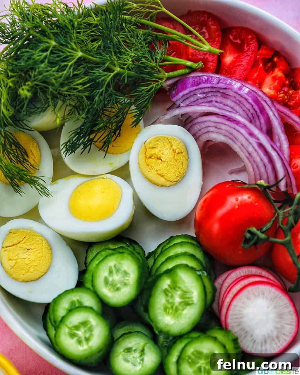 Brunch Grazing Platter 7 An assortment of sliced vegetables and hard-boiled eggs, enriching the brunch board with nutrition and visual appeal.