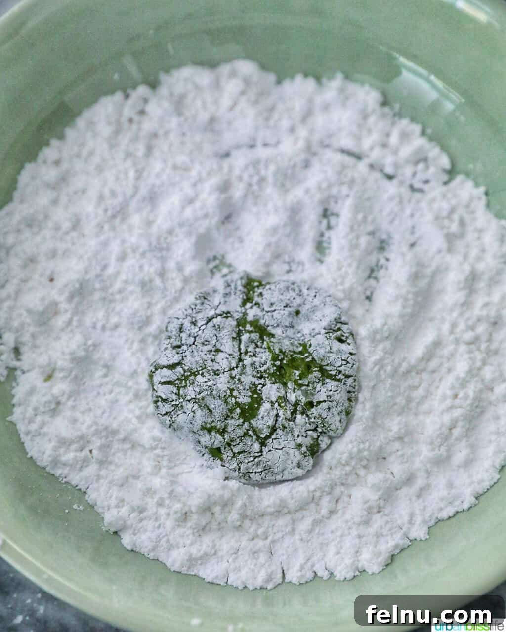 Matcha Magic Crinkles 16 Dough in powdered sugar