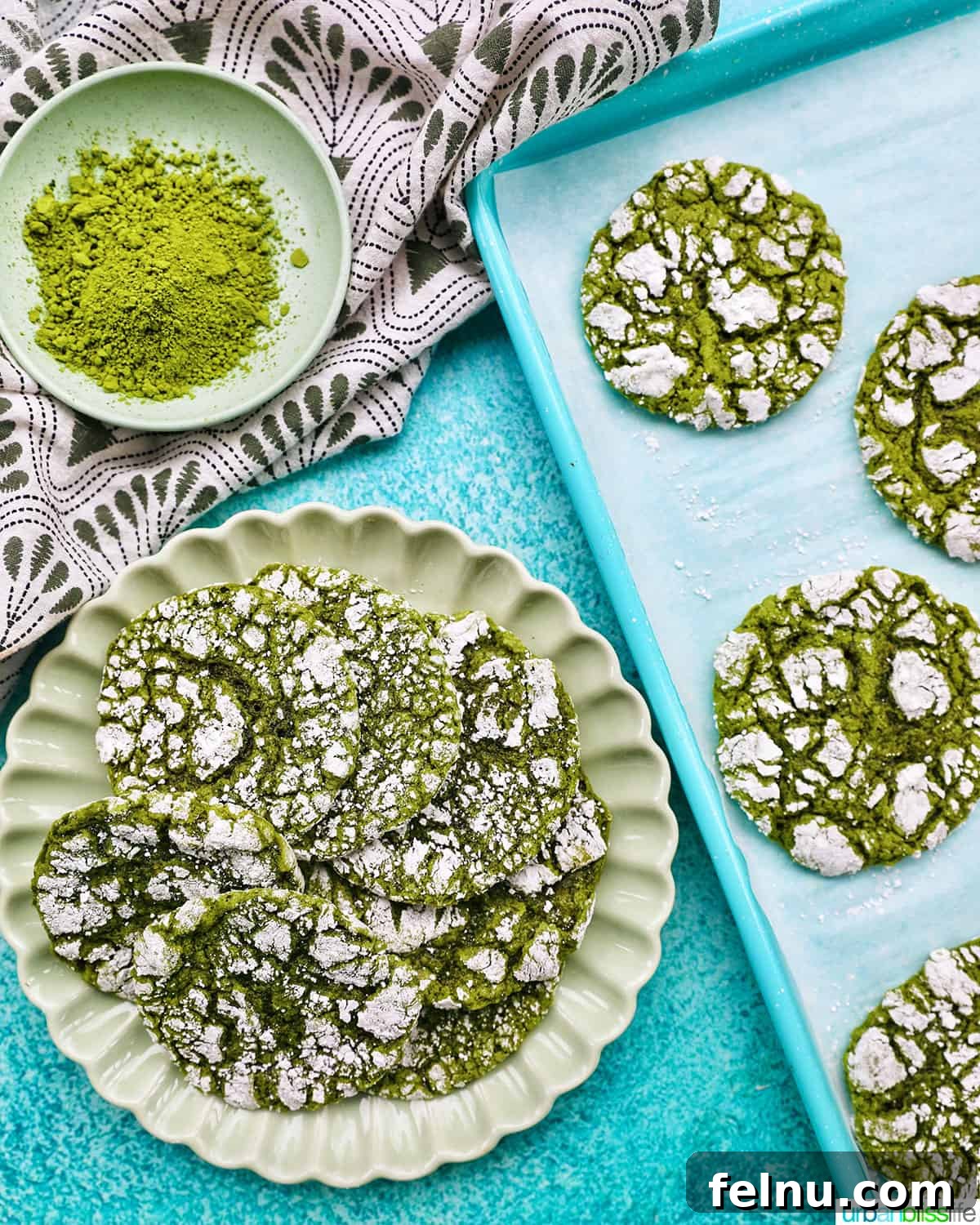 Matcha Magic Crinkles 5 Matcha Crinkle Cookies on a Plate and Baking Sheet