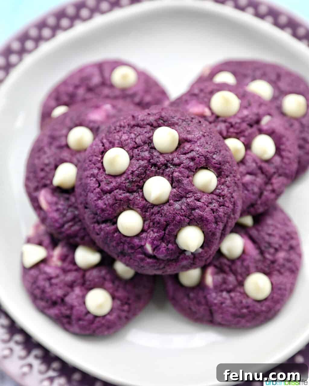 Ube and White Chocolate Dream Cookies 2 A stack of homemade Ube White Chocolate Chip Cookies showcases their vibrant purple color and tempting texture.
