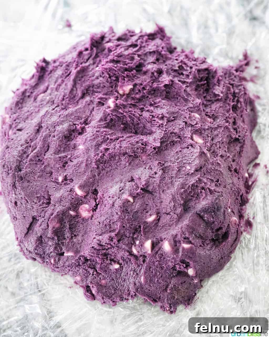 Ube and White Chocolate Dream Cookies 13 Ube cookie dough being formed into a round disc for chilling.