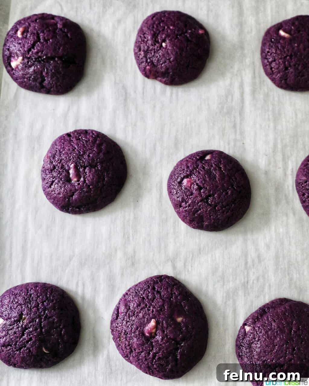 Ube and White Chocolate Dream Cookies 16 Ube White Chocolate Chip Cookies baking in the oven.