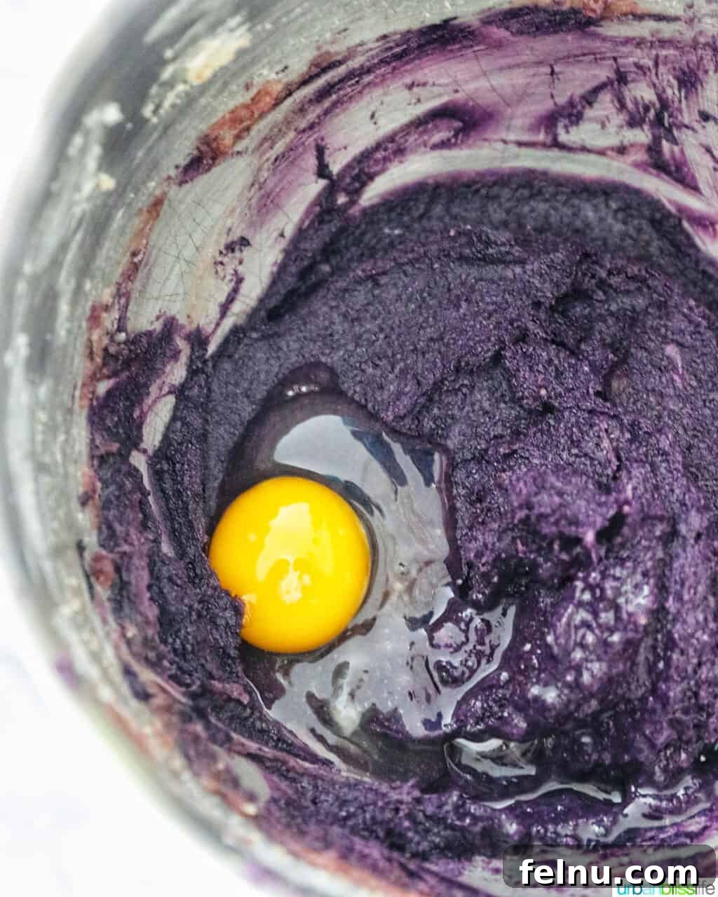 Ube and White Chocolate Dream Cookies 9 Eggs being added to the Ube cookie batter.