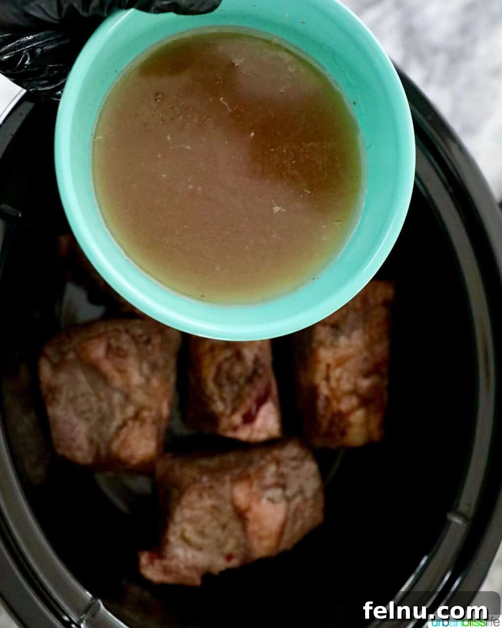 Slow Cooker Filipino-Style Beef Ribs Adobo 11 Adding Broth to Slow Cooker