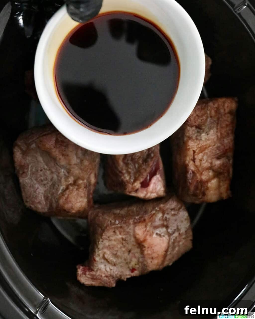 Slow Cooker Filipino-Style Beef Ribs Adobo 12 Adding Soy Sauce to Beef Short Ribs in the Slow Cooker