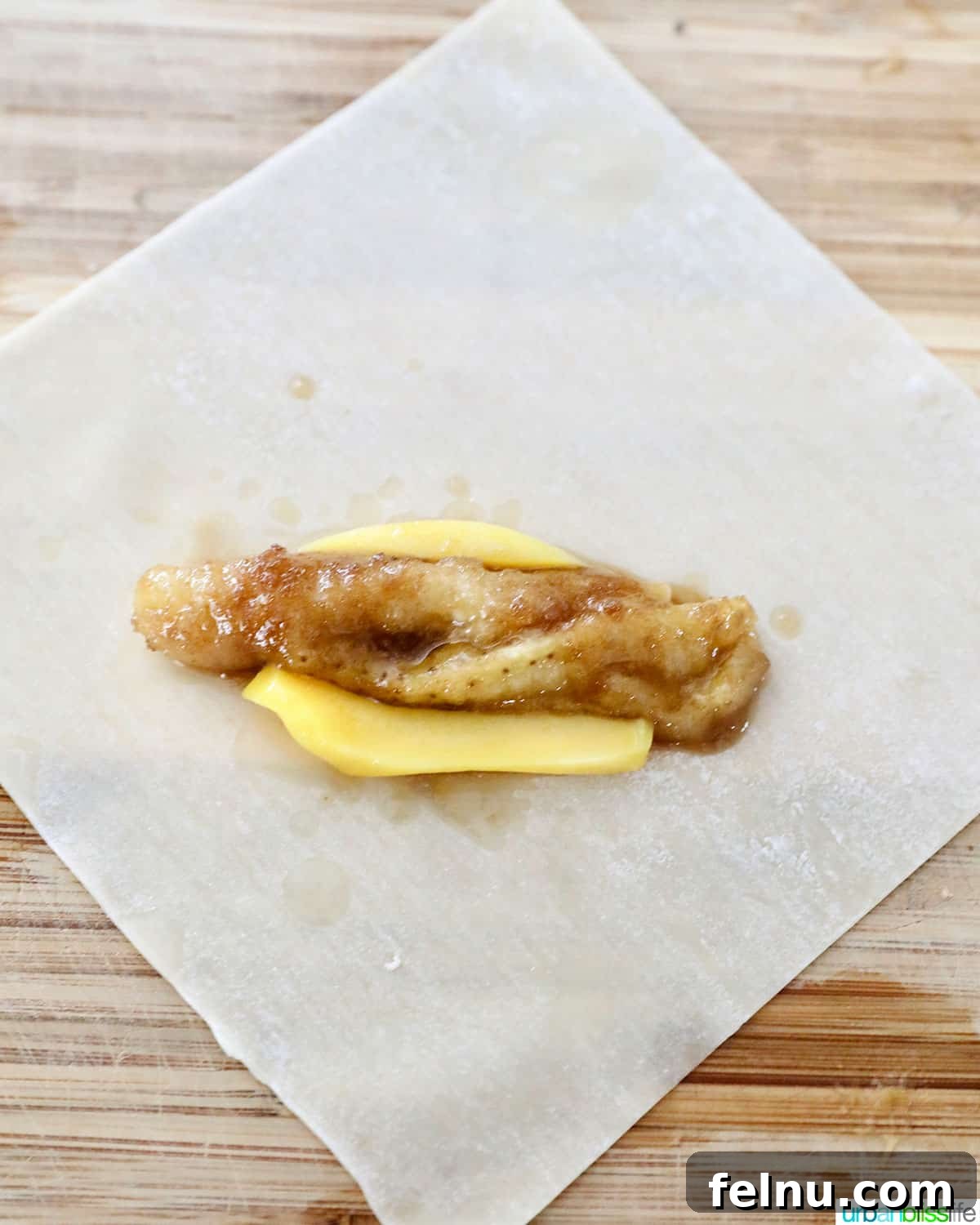 Effortless Filipino Turon: Crispy Banana Lumpia Perfection 11 Adding banana and jackfruit to egg roll to make Filipino turon banana lumpia.