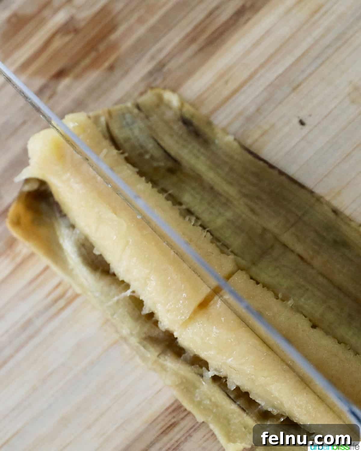 Effortless Filipino Turon: Crispy Banana Lumpia Perfection 5 Cutting bananas for Filipino turon banana lumpia.