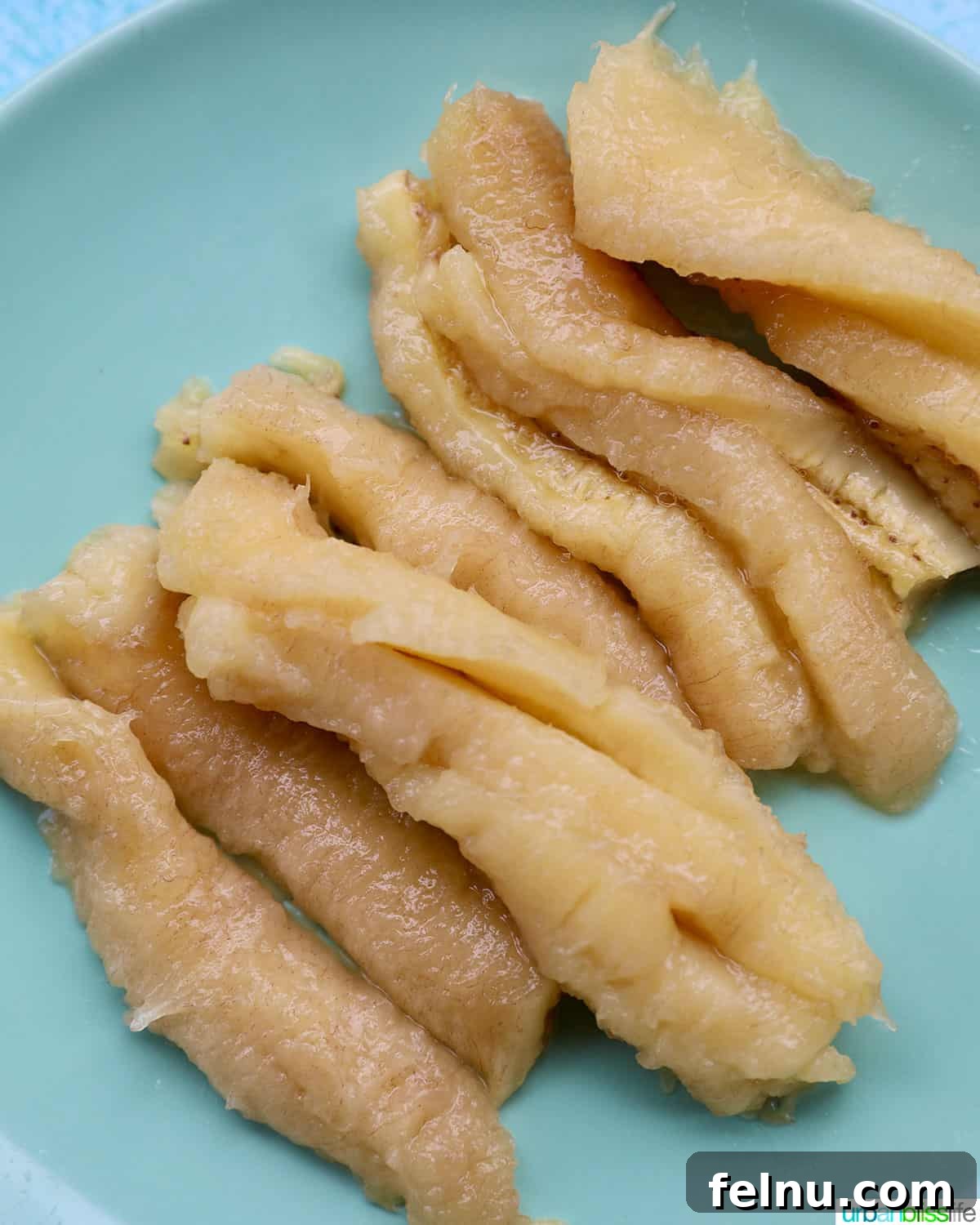 Effortless Filipino Turon: Crispy Banana Lumpia Perfection 6 Sliced bananas ready for turon.