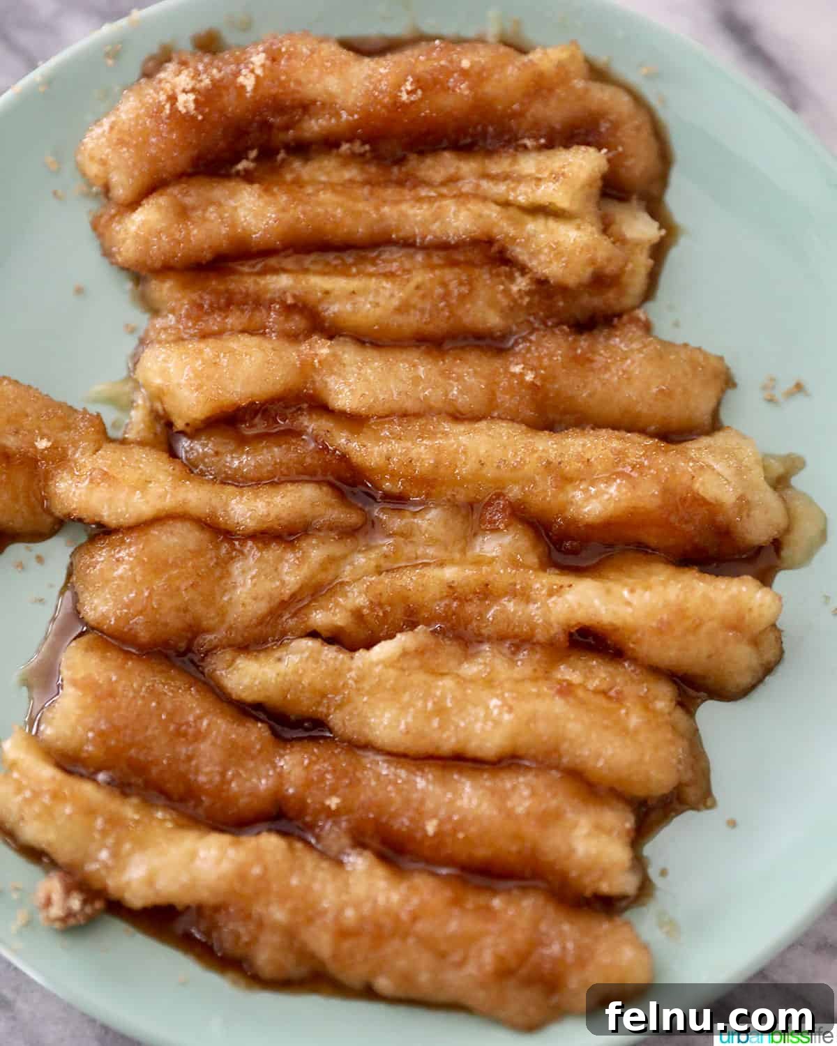 Effortless Filipino Turon: Crispy Banana Lumpia Perfection 9 Caramelized bananas ready for wrapping.